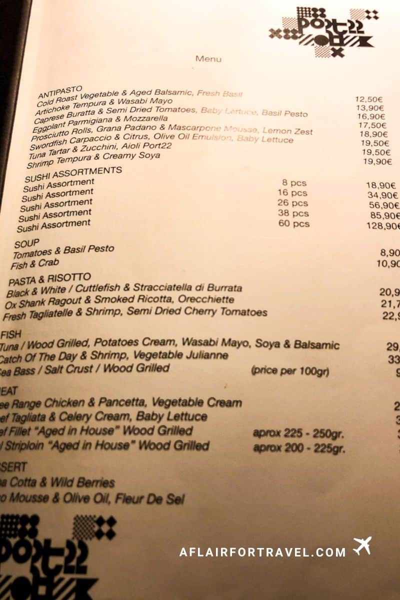 Port 22 restaurant menu showing antipasto, sushi assortments, pasta, fish, and meat options with prices in euros.