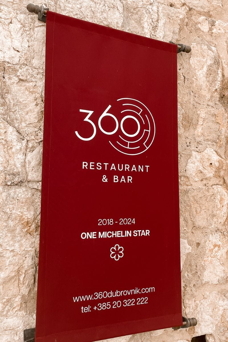 Restaurant 360 Dubrovnik Michelin Star sign on stone wall, award-winning restaurant with views of the historic city