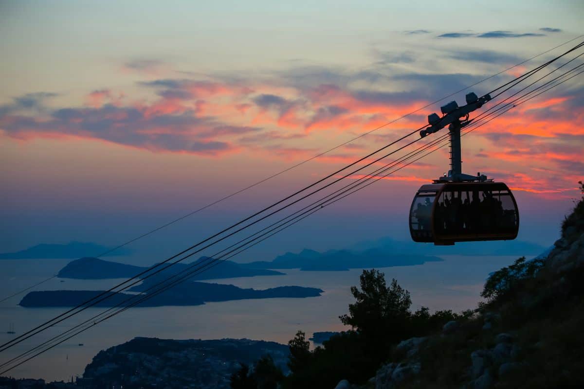 Dubrovnik cable car at sunset with panoramic view of Adriatic islands and coastline, route to Panorama Restaurant on Mount Srđ