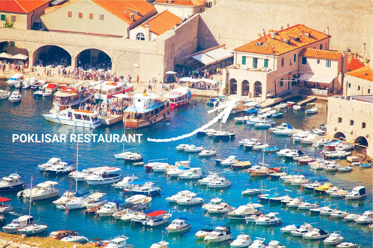 Poklisar Restaurant in Dubrovnik Old Town with a waterfront view of the harbor and boats, a popular Dubrovnik restaurant with a view.