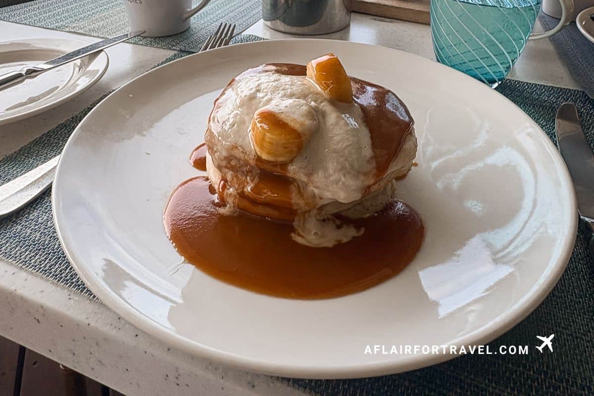 Gourmet breakfast pancakes with caramelized bananas and sauce served at Cap Maison resort restaurant in St. Lucia