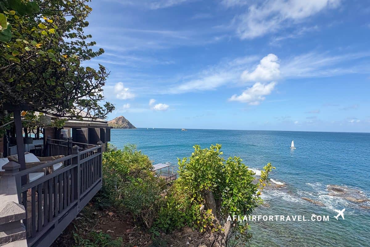Panoramic Caribbean Sea views from clifftop resort terrace overlooking turquoise waters and rocky coastline of; the views are one of the top reasons to stay at Cap Maison St. Lucia