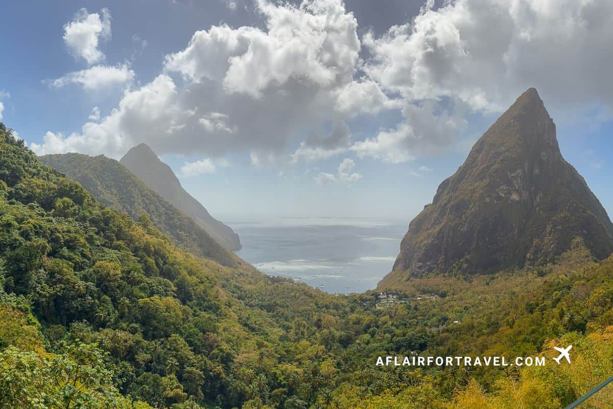 Iconic Pitons mountains rising from lush rainforest valley overlooking Caribbean Sea in St. Lucia, one of many reasons to stay at Cap Maison St. Lucia