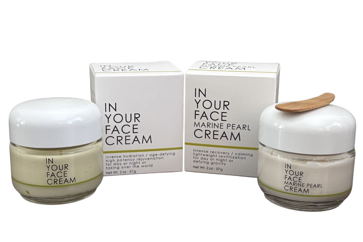 In Your Face Cream and Marine Pearl Cream in 2 oz glass jars with white lids and product packaging
