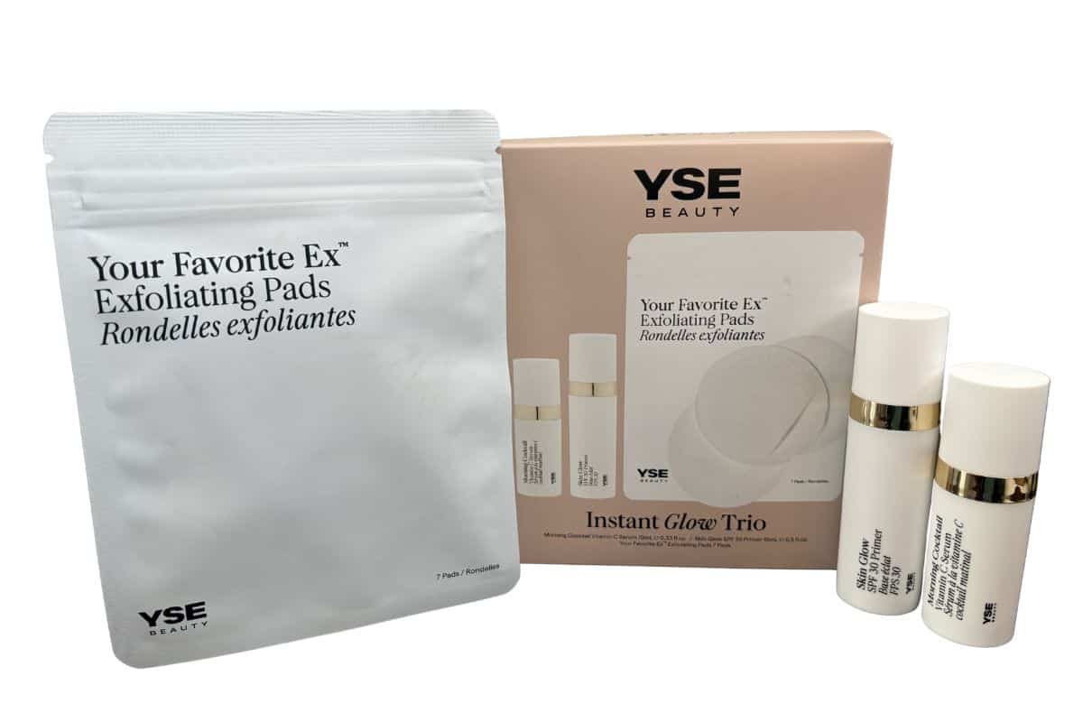 YSE Beauty Instant Glow Trio kit with TSA-friendly exfoliating pads pouch, vitamin C serum, and Skin Glow SPF Primer skin care products for travel