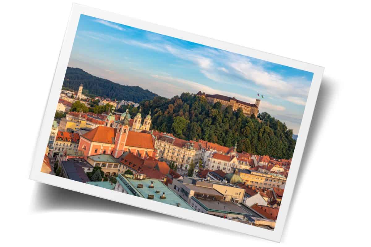 Aerial view of Ljubljana's Old Town rooftops and castle hill, a must-see when planning a trip to Slovenia