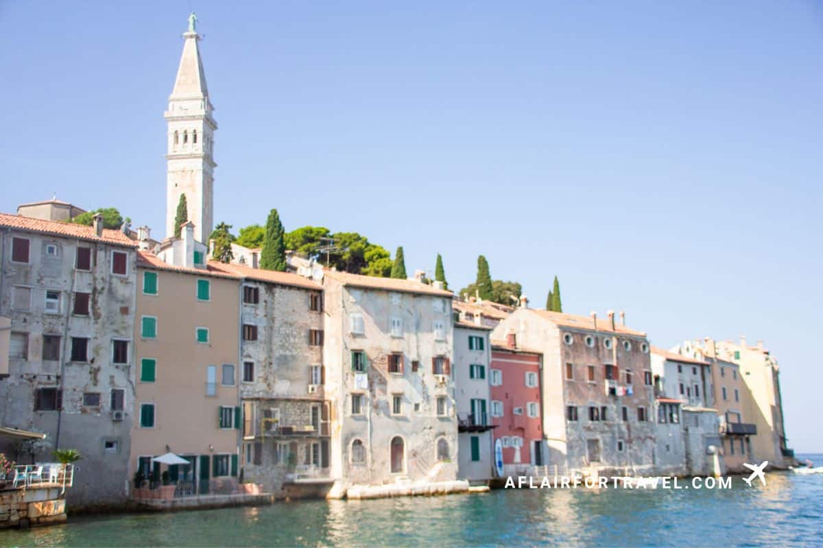 Colorful historic buildings of Rovinj old town Croatia rising from the Adriatic Sea with St Euphemia church bell tower