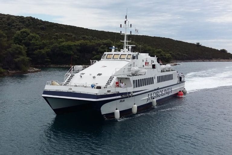A Jadrolinija ferry navigating the Croatian coast between islands, an essential way to get around and a key Croatia travel tip for first-time visitors