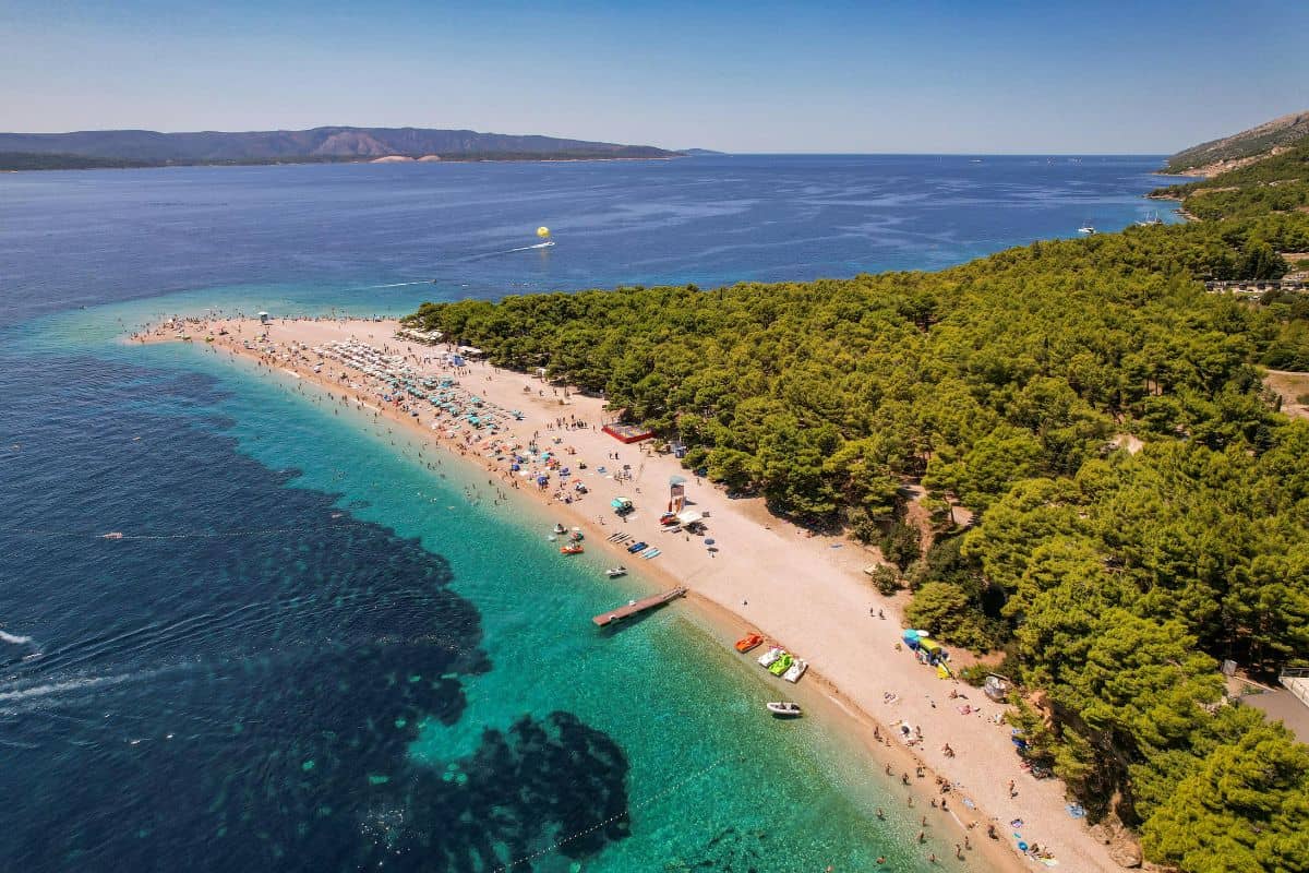 Aerial view of Zlatni Rat beach on the island of Brač with its distinctive pebbly peninsula surrounded by turquoise Adriatic waters