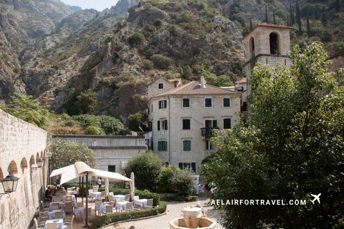 Kotor, Montenegro, one of the best day trips from Dubrovnik, featuring historic stone buildings and dramatic mountain scenery in Montenegro’s Bay of Kotor.