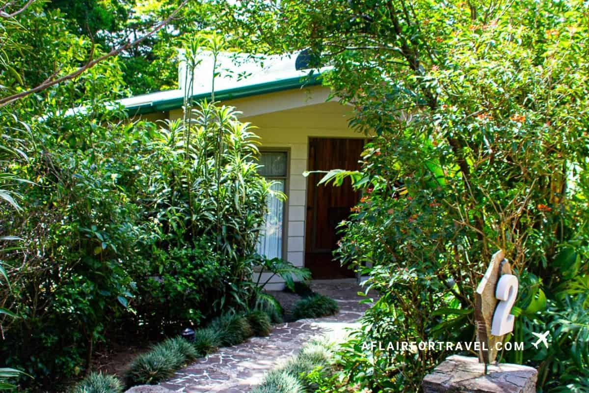 Cabin number 2 tucked into lush foliage, a peaceful option for where to stay in Monteverde Costa Rica