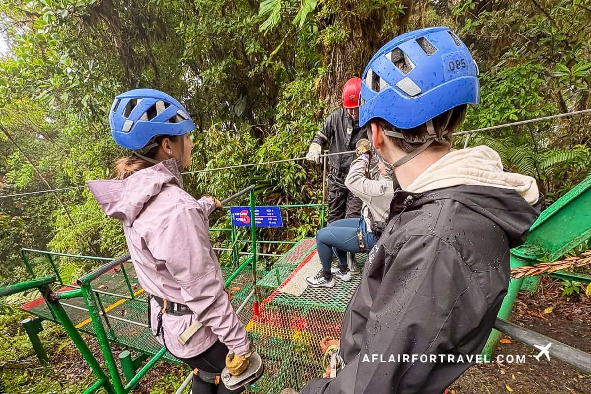 Helmeted visitors preparing to zipline, a thrilling addition to things to do in Monteverde, Costa Rica