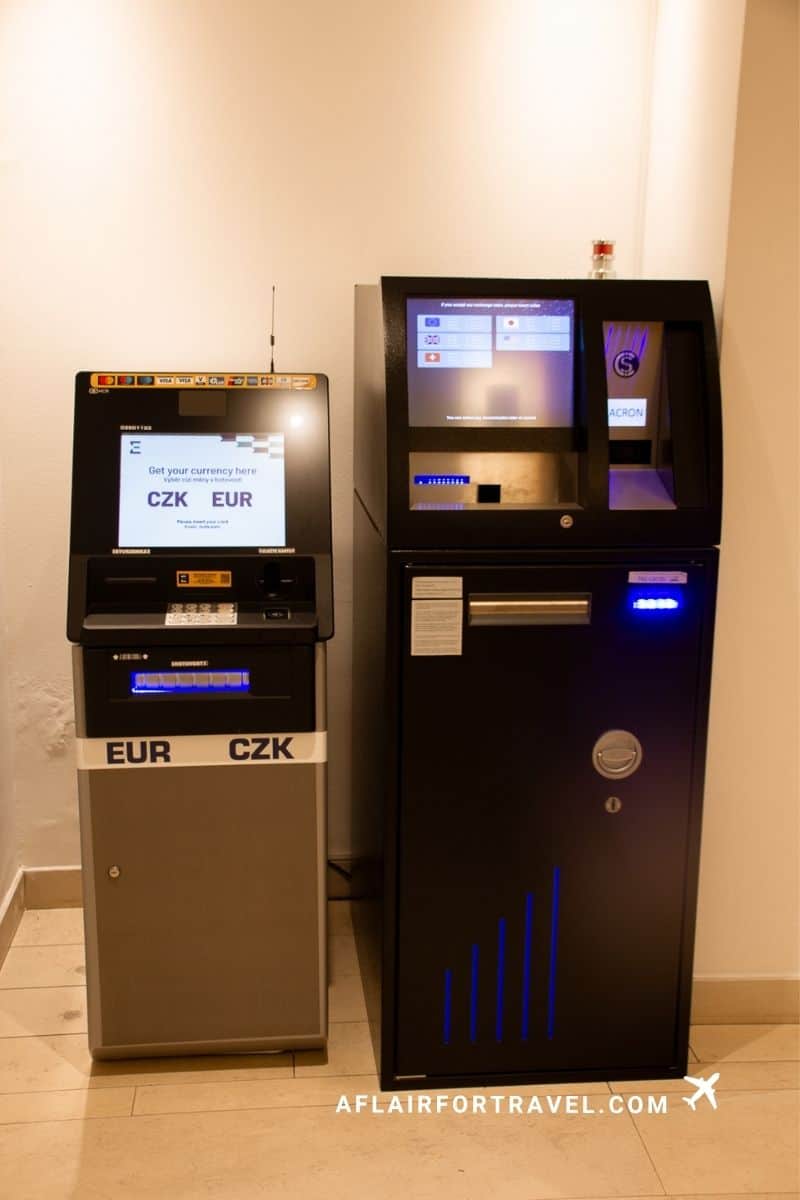 Currency exchange machines in a hotel offering EUR and CZK, a Prague travel tip for where to change money