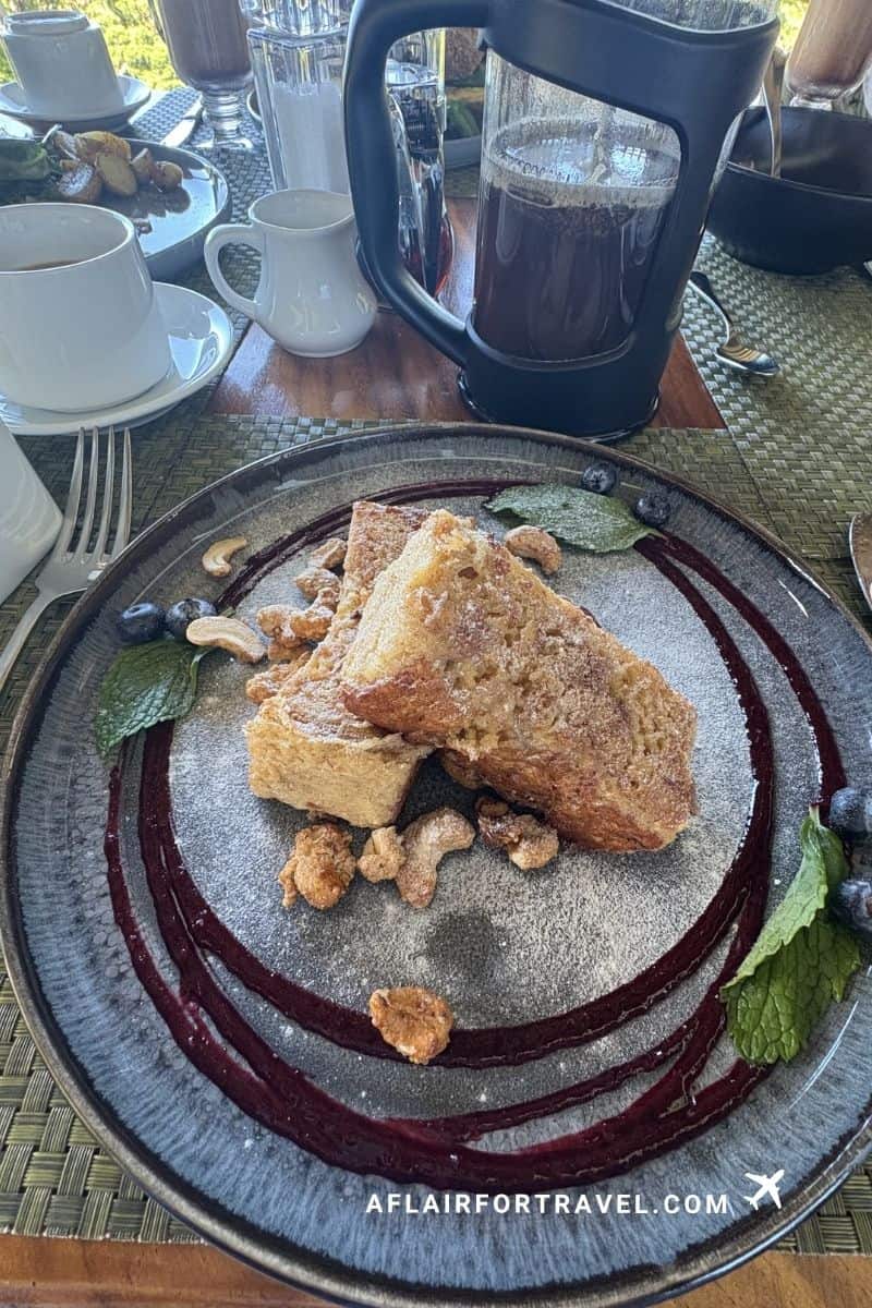 Costa Rican-style french toast breakfast plate with coffee, served at a Monteverde Costa Rica hotel