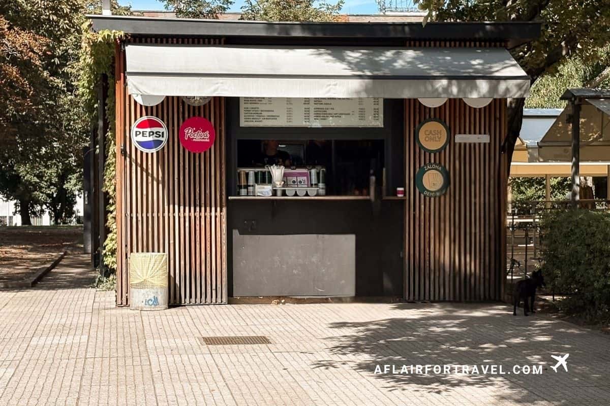 Outdoor drink kiosk in Letná Park with a cash-only sign, Prague