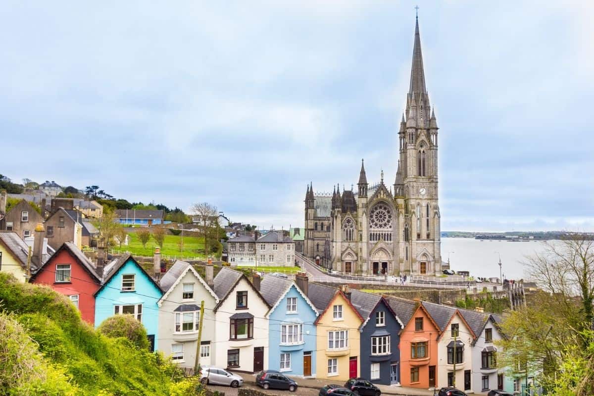 Colorful row houses below St. Colman's Cathedral in Cobh, Ireland