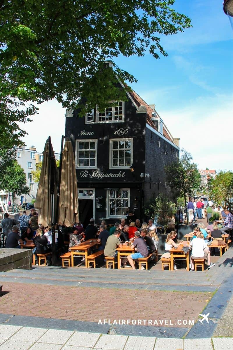 Historic De Sluyswacht pub on an Amsterdam canal, Netherlands