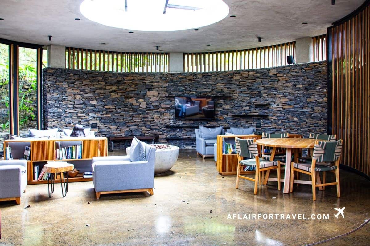 Cozy stone-walled lounge with skylight at a Monteverde Costa Rica hotel