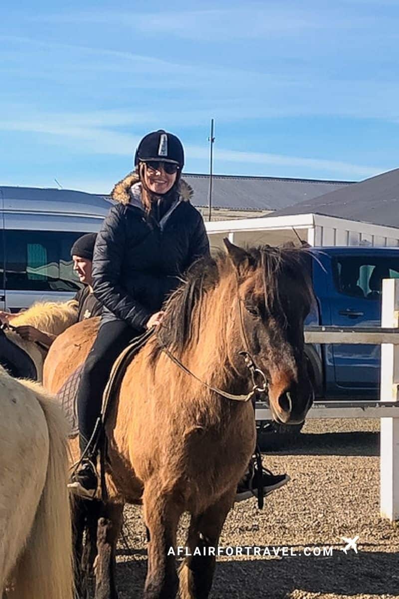 Smiling rider on an Icelandic horse before a countryside trail ride