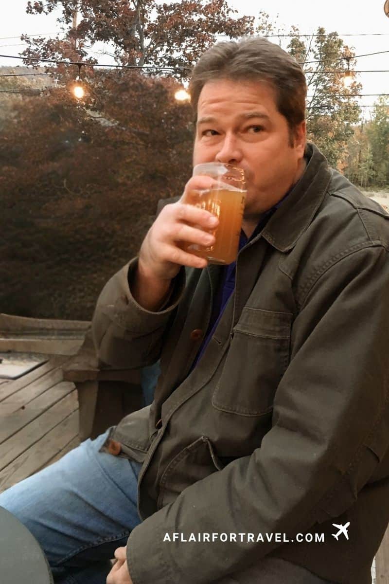 Relaxing at an outdoor brewery patio in the White Mountains during autumn.