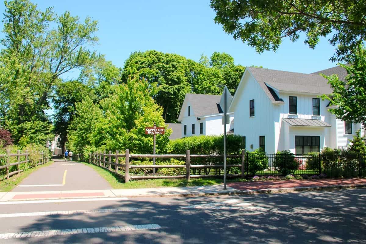 Clipper City Rail Trail entrance near a classic New England home, a dog-friendly Newburyport MA walking spot