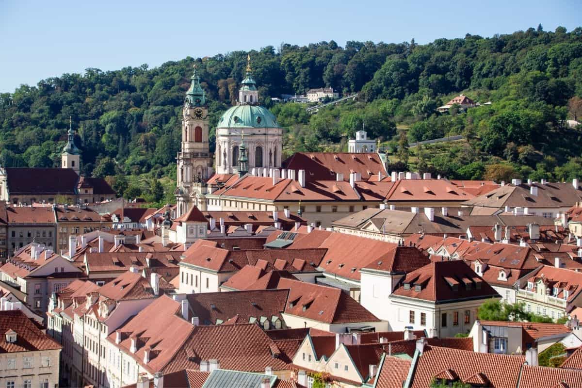 Aerial view of Malá Strana's terracotta roofs and church spires