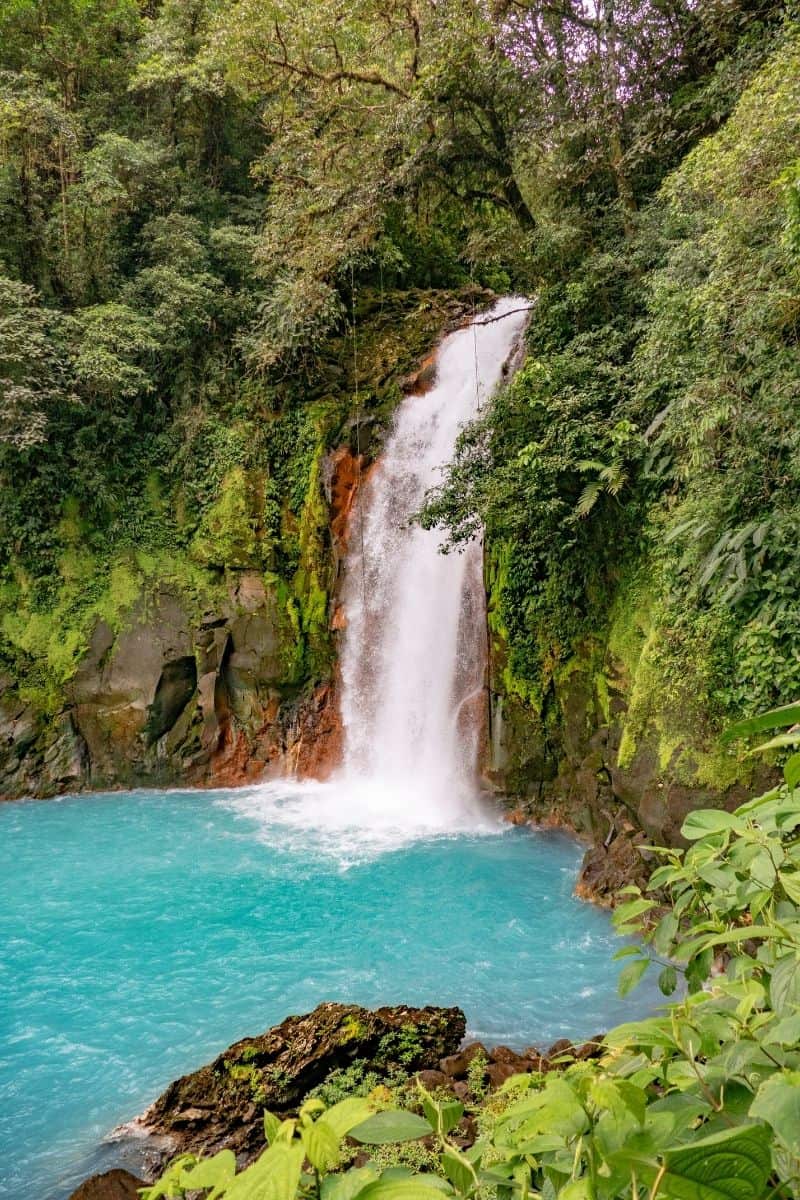 La Fortuna Waterfall near Arenal, a popular attraction to visit after flying into either of the international Costa Rica airports