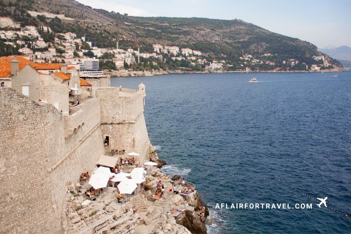 Dubrovnik city walls overlooking Buza Bar and the Adriatic coastline
