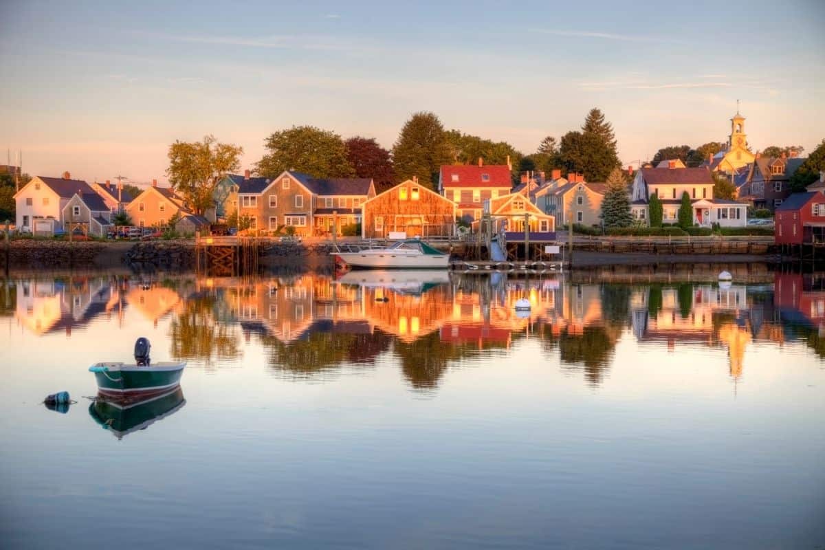 Historic waterfront homes reflected in Portsmouth Harbor at sunset in New Hampshire