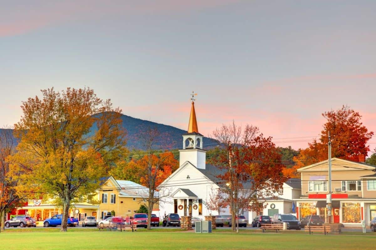 North Conway town common with white church and fall foliage in the White Mountains