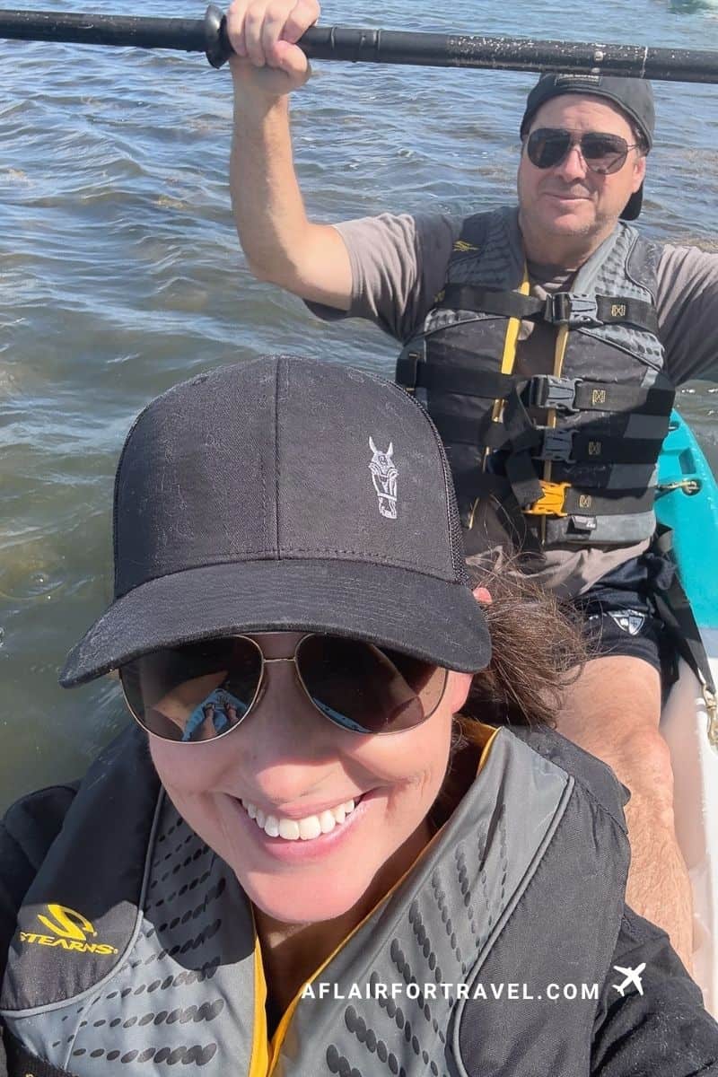 Couple taking a selfie while kayaking on the water, enjoying one of New Hampshire's fall activities
