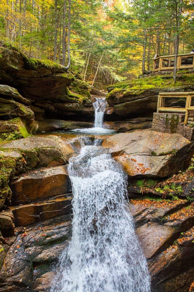 Sabbaday Falls near the Kancamagus Highway flowing through a mossy gorge in the White Mountains in the fall