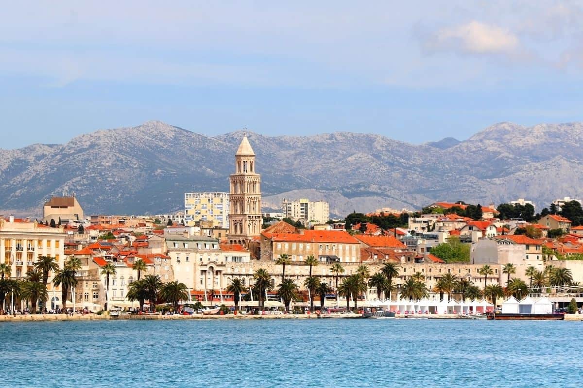 Split's waterfront skyline and bell tower with the Dinaric Alps in the background