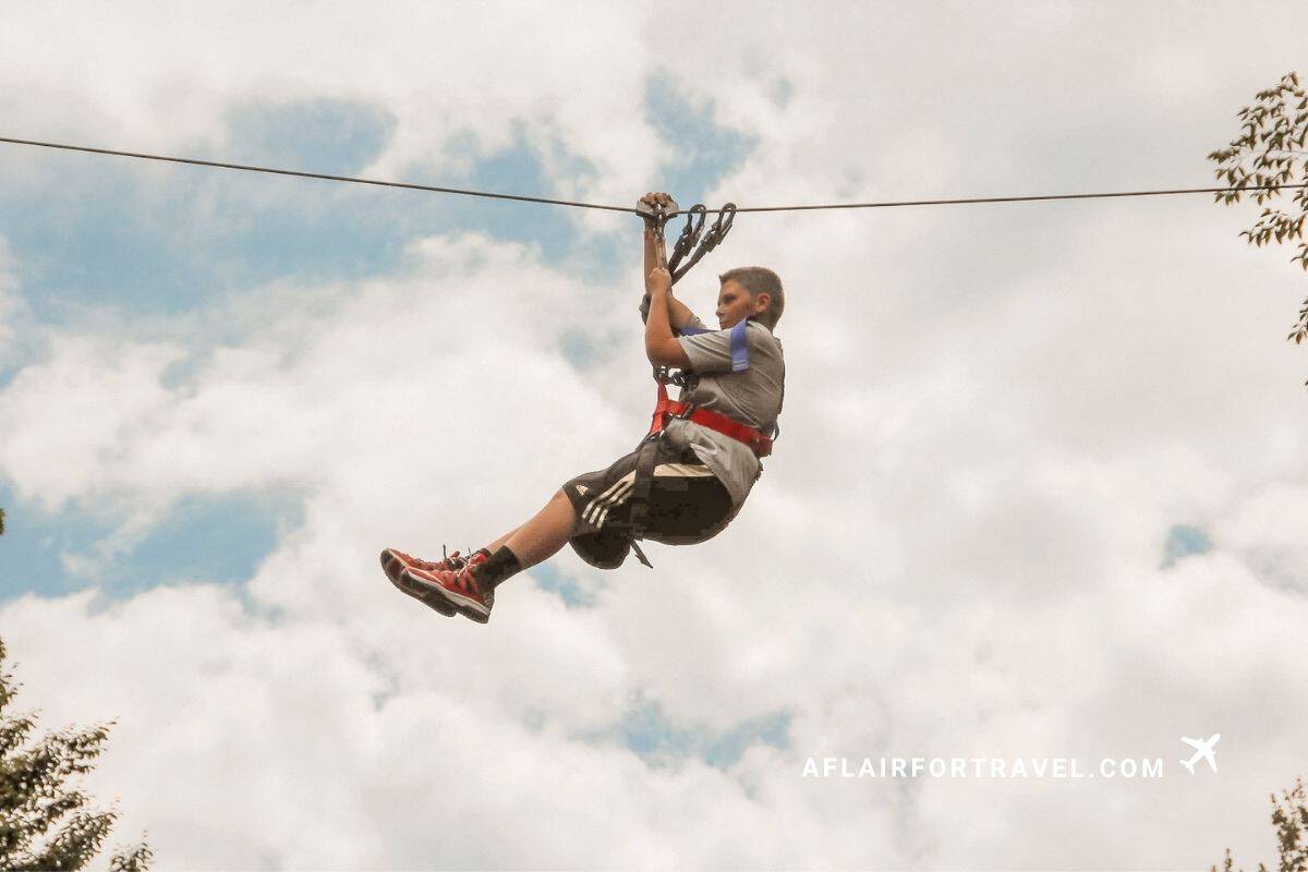 Ziplining through the trees in New Hampshire during the fall.