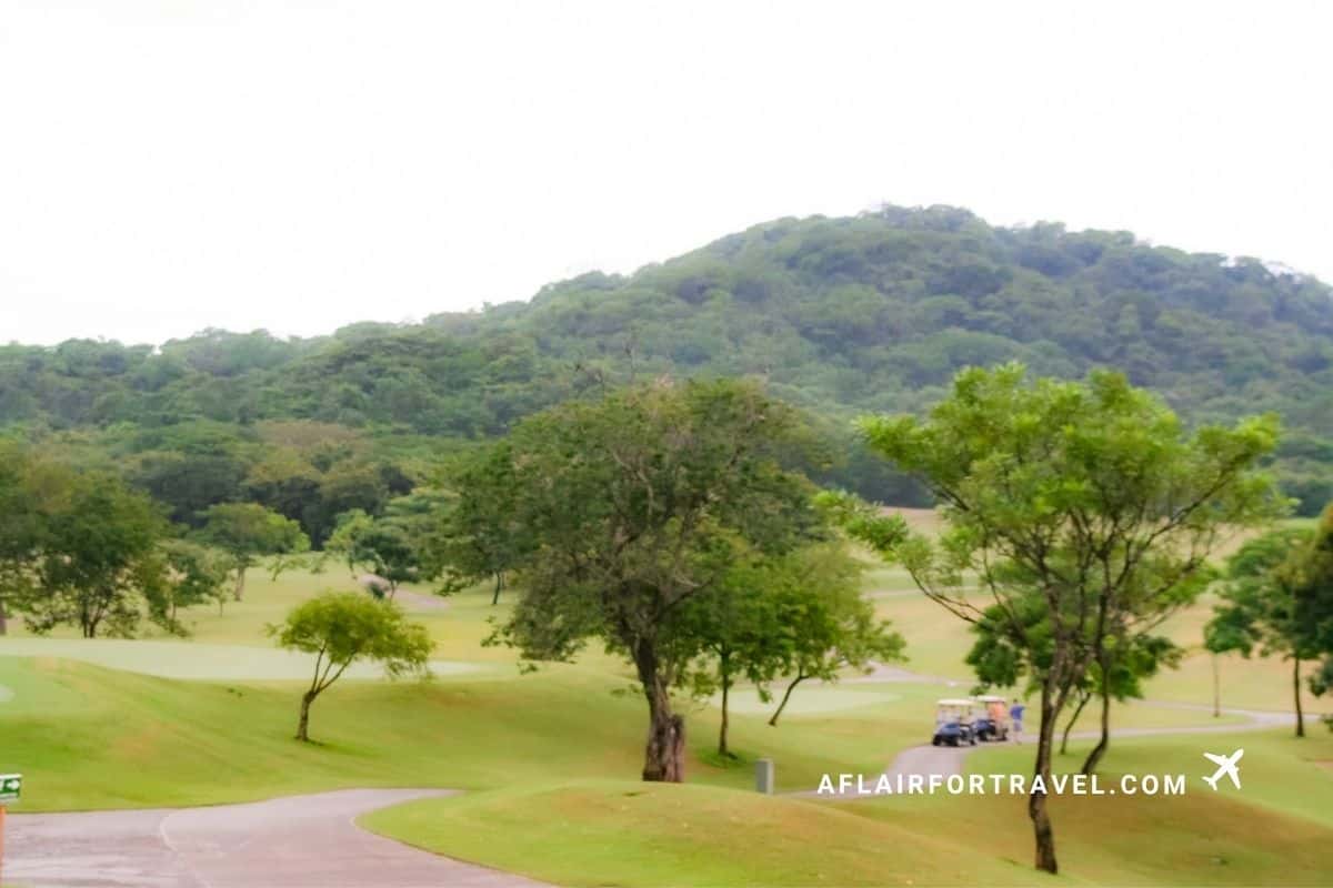 Golf carts on the course with mountain views in Costa Rica