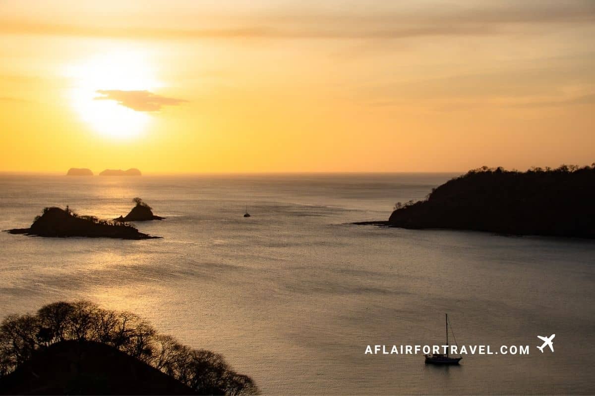 Sunset over Culebra Bay with a sailboat and small islands, Guanacaste, Costa Rica