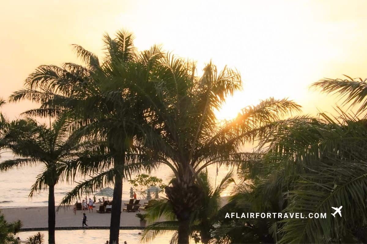 Sunset through palm trees over the beach at a Guanacaste, Costa Rica resort
