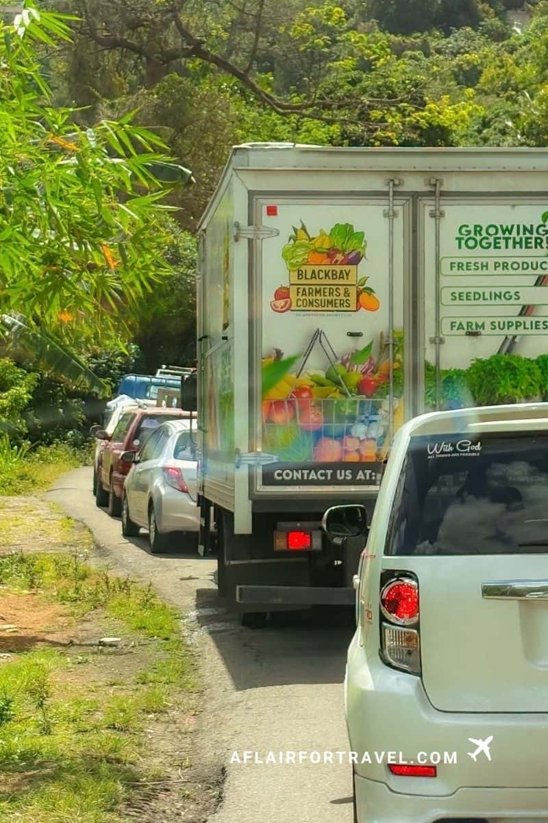 Traffic on a narrow mountain road, a reminder that cautious driving matters when considering if St. Lucia is safe for visitors