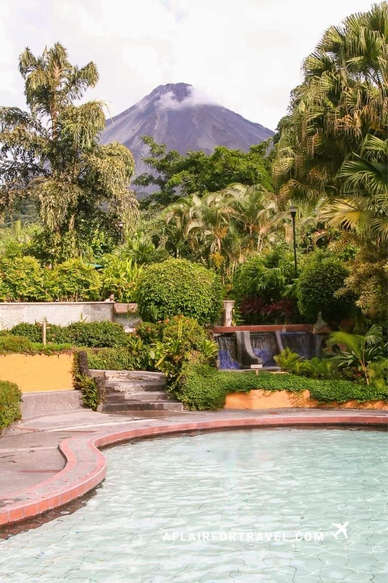 Garden hot springs pool with Arenal Volcano rising in the background near La Fortuna