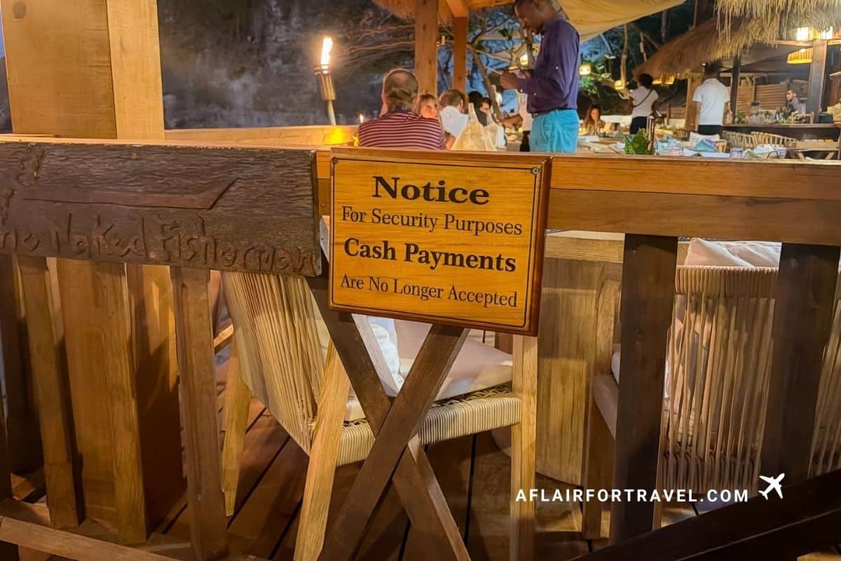 "Cash Payments Are No Longer Accepted" security notice at a beachfront restaurant, one of several measures that answer the question of whether St. Lucia is safe